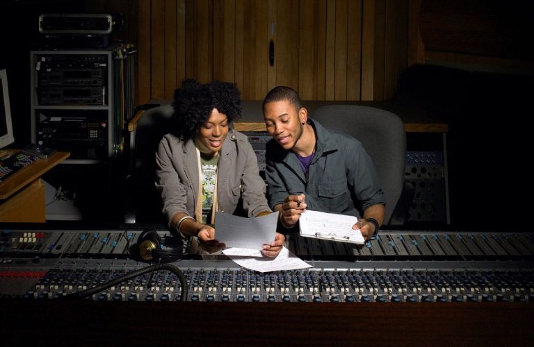 Two people working in studio